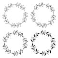 Wreaths of leaves and branches. Set of four black and white vector round floral frames. Royalty Free Stock Photo